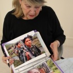 Linda Marie Coakley reviews some of the photos related to the project